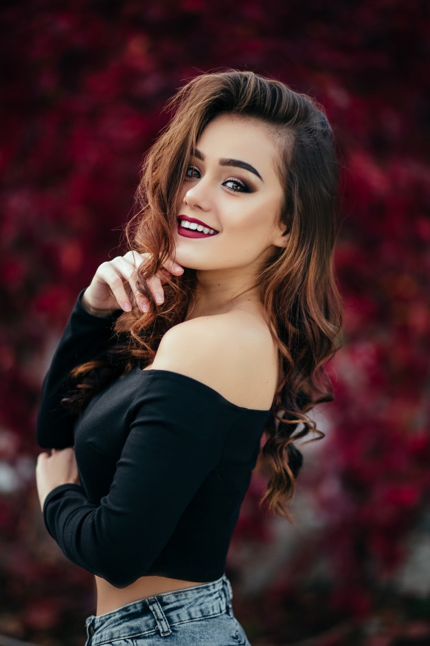 undefined 3107 beautiful girl stands near walll with leaves 8353 5377