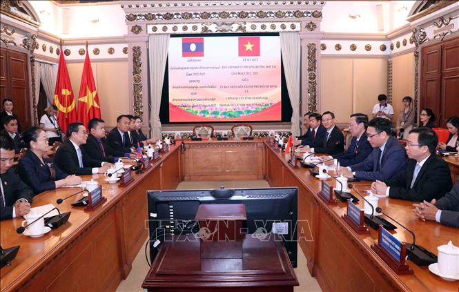 Thành phố Hồ Chí Minh và tỉnh Champasak, Lào ký thỏa thuận hợp tác hữu nghị Chú thích ảnh