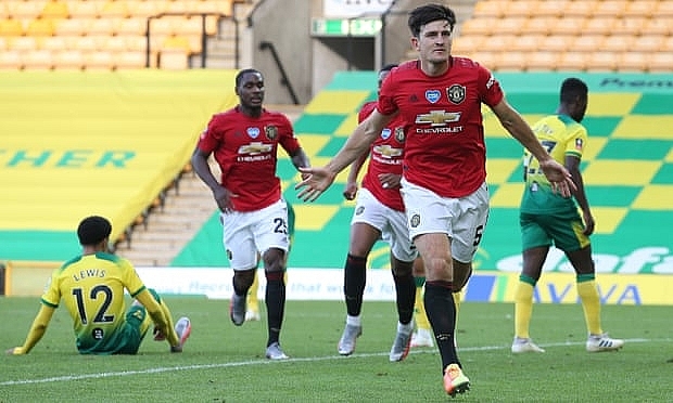 undefined Harry Maguire celebrates scoring of Manchester United’s second and decisive goal in their FA Cup quarter-final at Norwich. Photograph: Matthew Peters/Manchester United/Getty Images